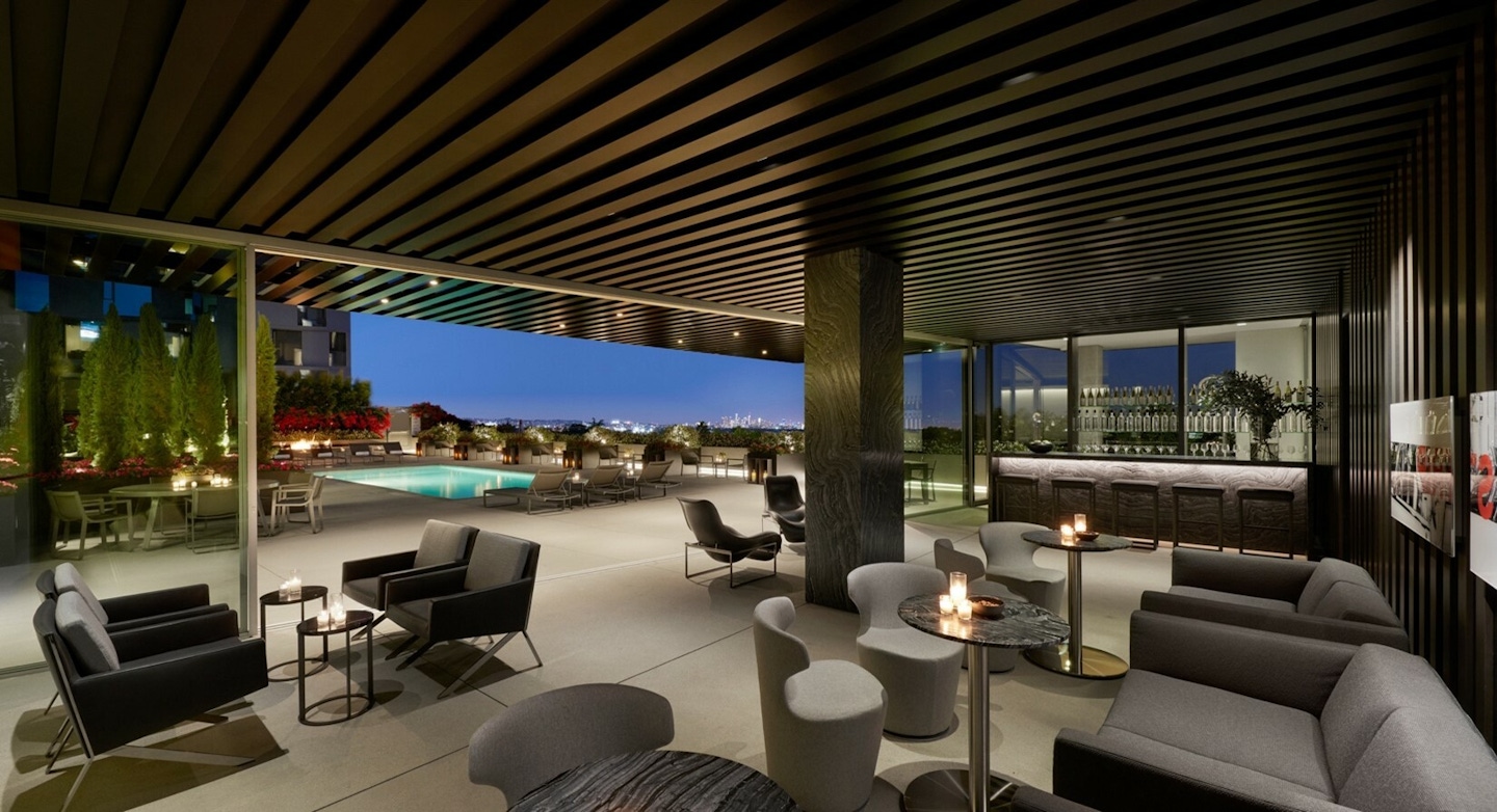 A lounge and pool deck at AKA West Hollywood, a furnished luxury apartment residence | AKA West Hollywood